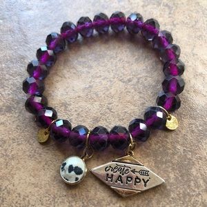 Purple Glass beaded bracelet with charms